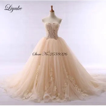 Элегантное свадебное платье цвета шампанского без бретелек А-силуэта контрастного цвета со шлейфом Cohapel, сшитое на заказ свадебным платьем невесты
